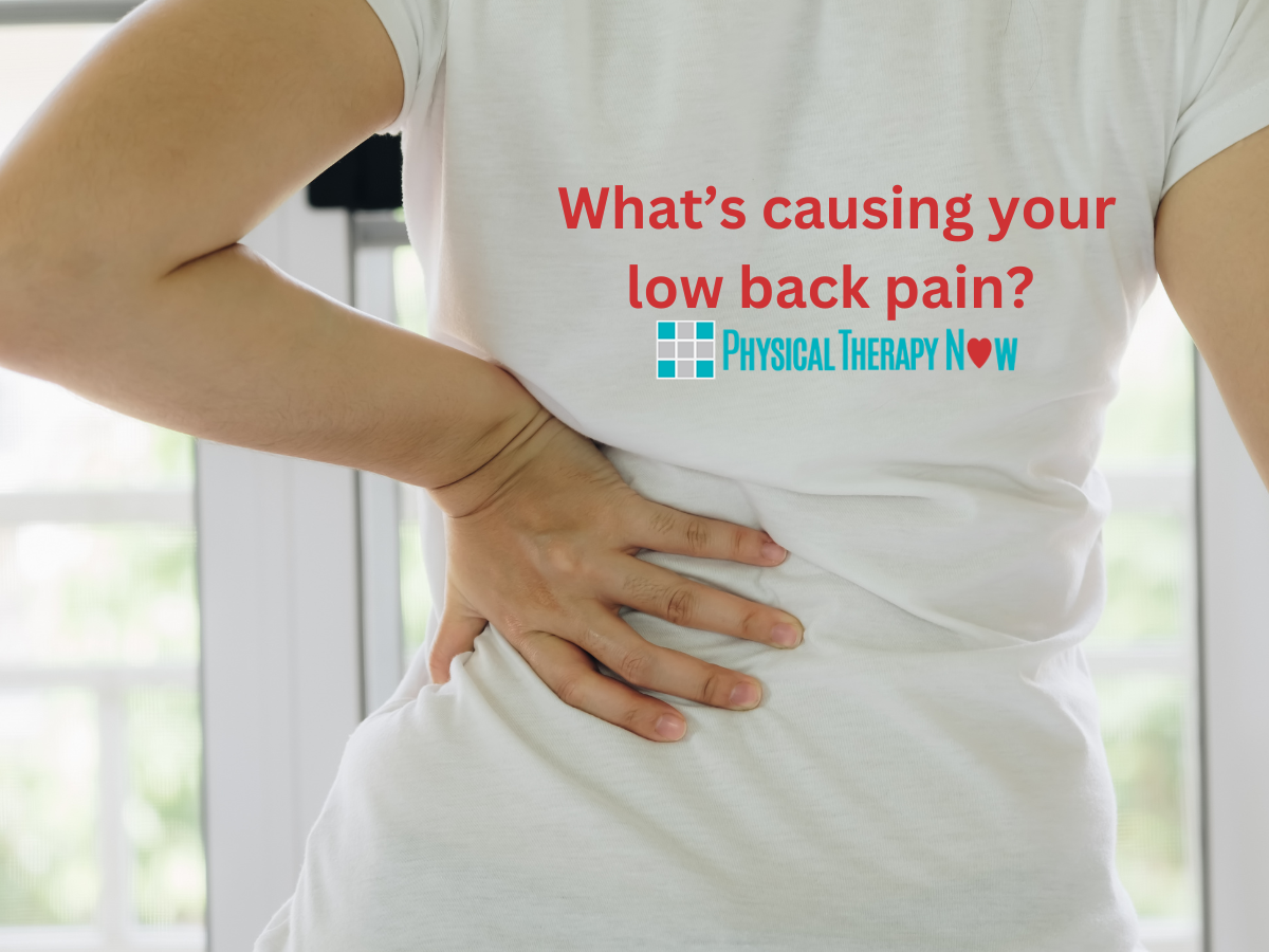 woma in white shirt holding lower back because of low back pain